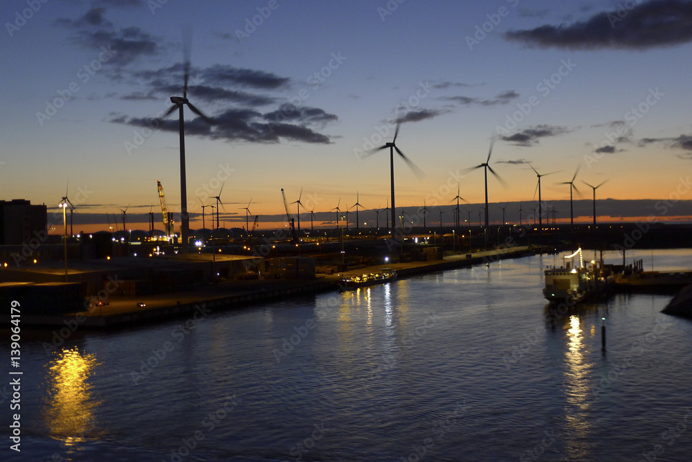 Energy windmills in sunset