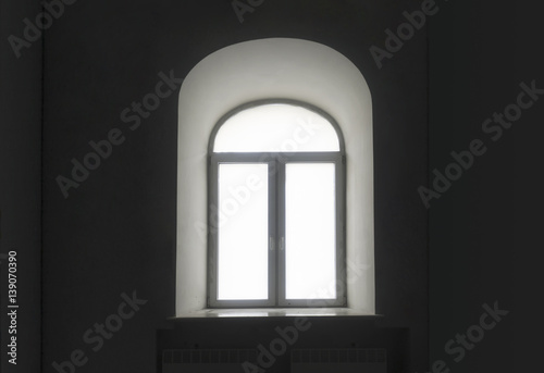 white semicircular modernist windows on a black wall
