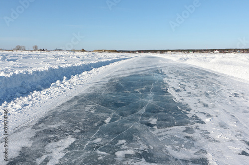 Ice road on a frozen reservoir in the winter,  Ob River, Siberia, Russia