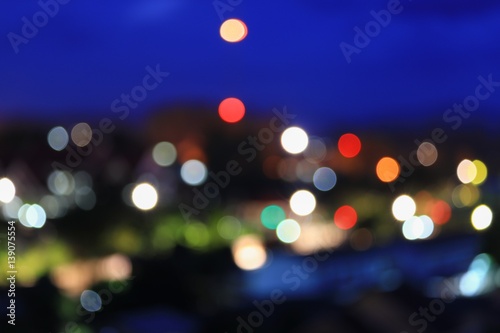 Abstract bokeh multi-color city blurred elevated night view for background with copy space for add text