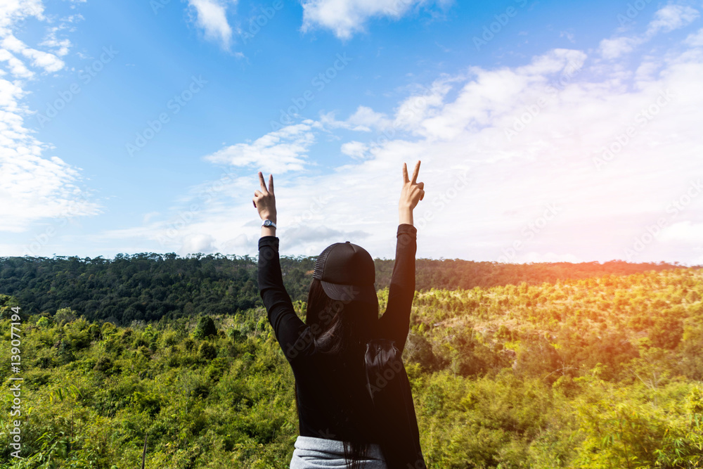 woman stand on mountain with beautiful blue sky. subject is blurred woman stand on mountain with beautiful blue sky. subject is blurred