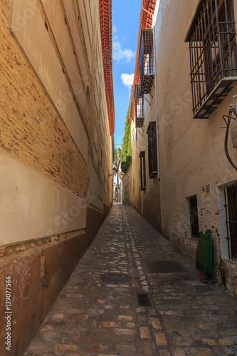 Fototapeta Naklejka Na Ścianę i Meble -  View of a very narrow street with old houses on the sides