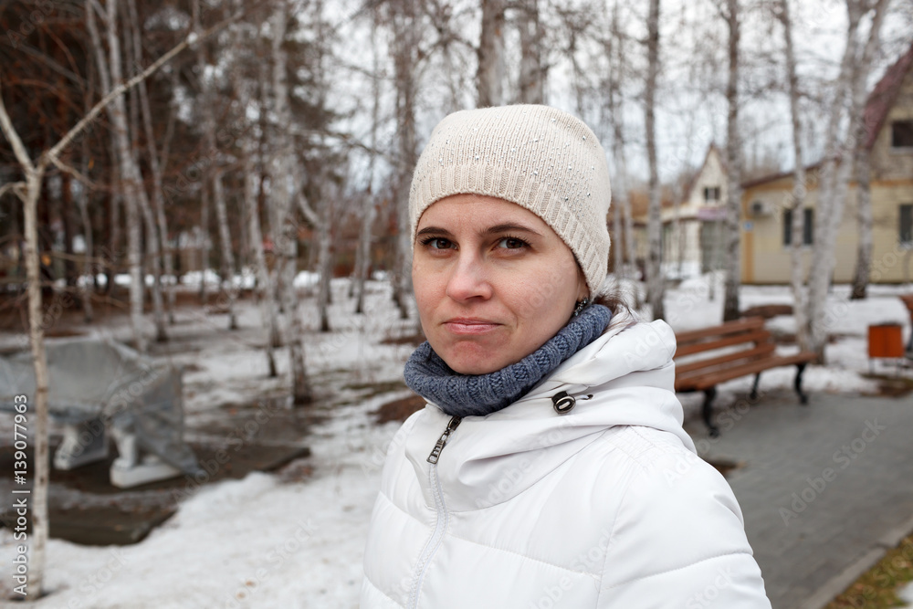 The woman's portrait in the winter on the street The woman's portrait in the winter on the street