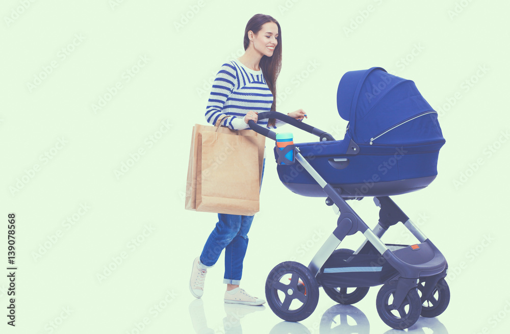 Full length portrait of a mother with a stroller, isolated on white background