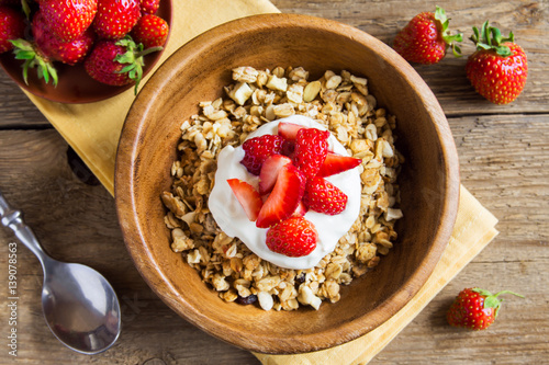 Homemade granola with yogurt and strawberries