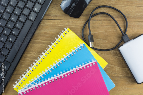 The school supplies placed on the wooden floor