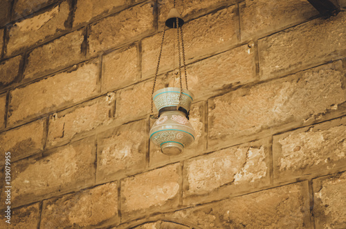 old lamp on wall at old mosque at cairo, egypt
