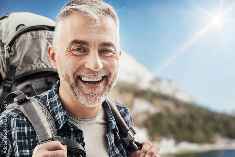 Hiker trekking on the mountains Hiker trekking on the mountains