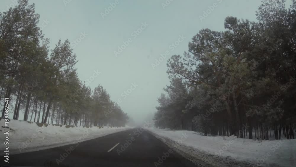 Driving car in winter in fog Driving car in winter in fog