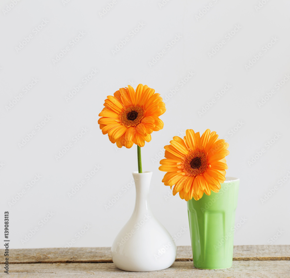 Gerbera in vase on old wooden table Gerbera in vase on old wooden table