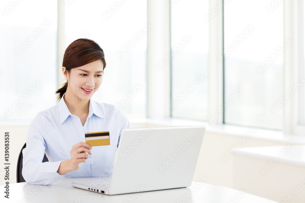 young woman shopping with credit card and laptop young woman shopping with credit card and laptop