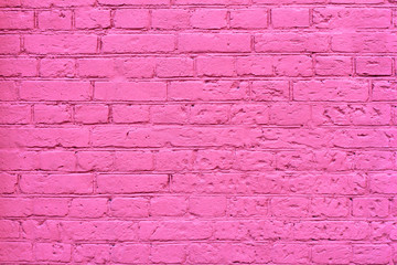 Grunge pink brick wall as background, texture