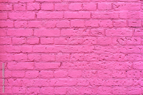 Grunge pink brick wall as background, texture