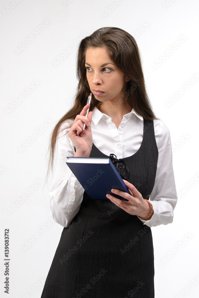 Beautiful young business woman with notebook, on white Beautiful young business woman with notebook, on white