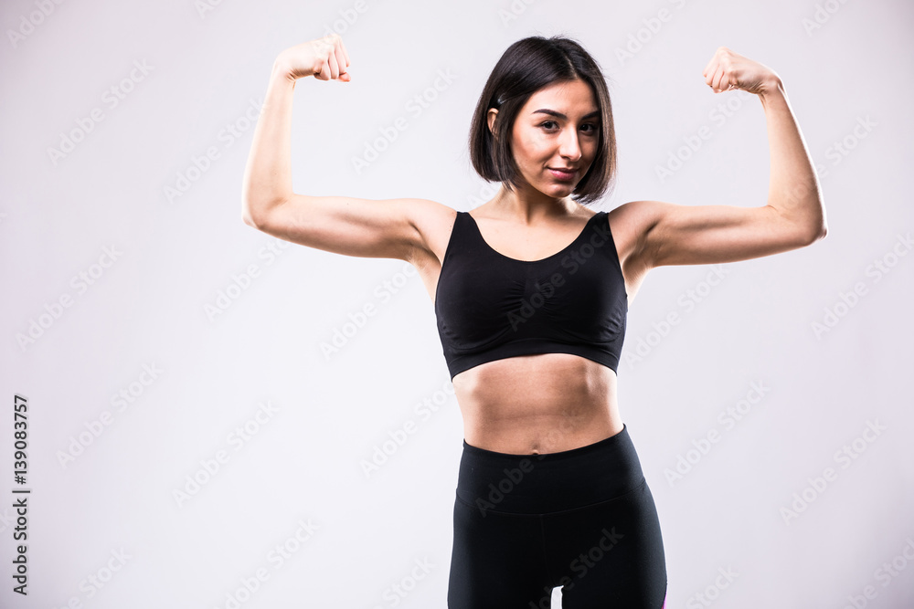 Portrait of a happy elegant woman showing her biceps Portrait of a happy elegant woman showing her biceps