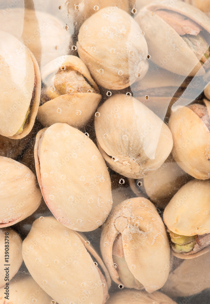 Roasted pistachio nuts in package close up