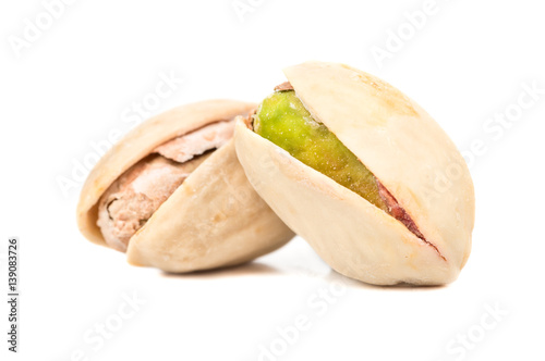 Two dry pistachio nut isolated on white background