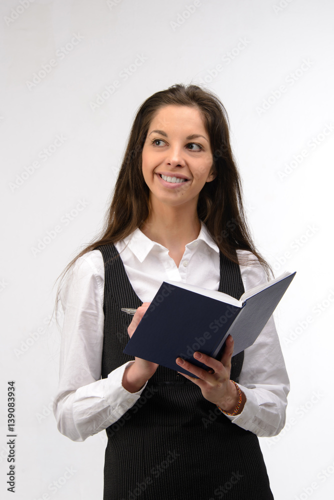 Beautiful young business woman with notebook, on white Beautiful young business woman with notebook, on white