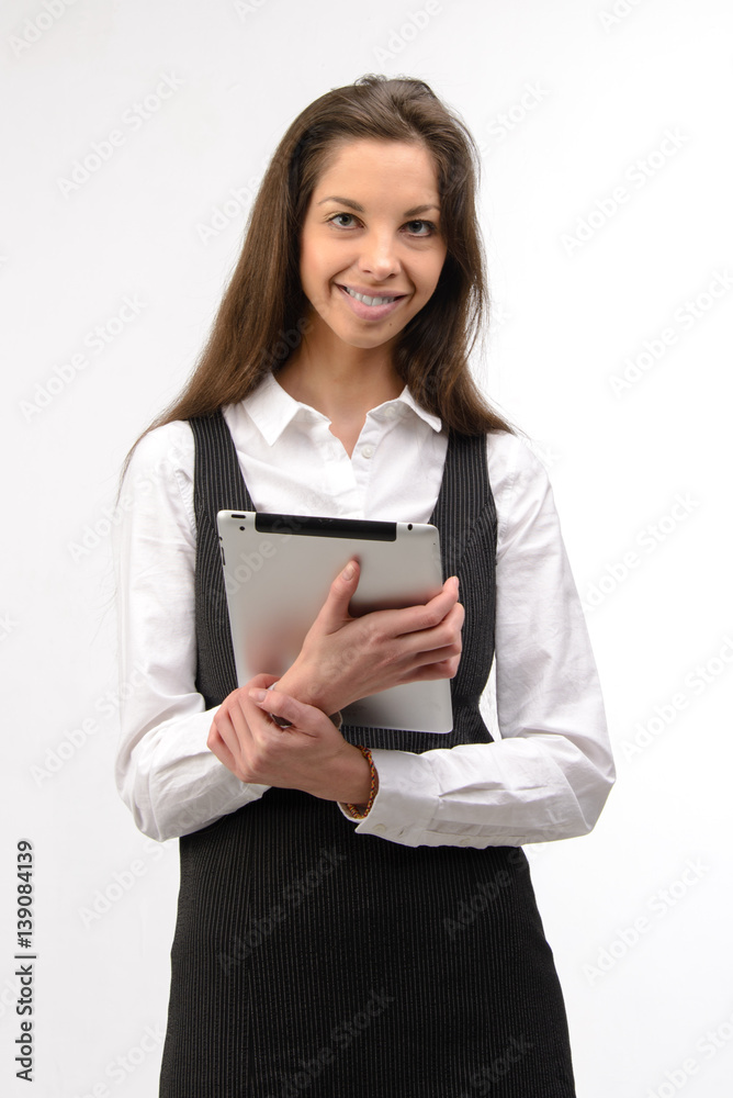 Attractive young business woman holding a digital tablet, on white Attractive young business woman holding a digital tablet, on white