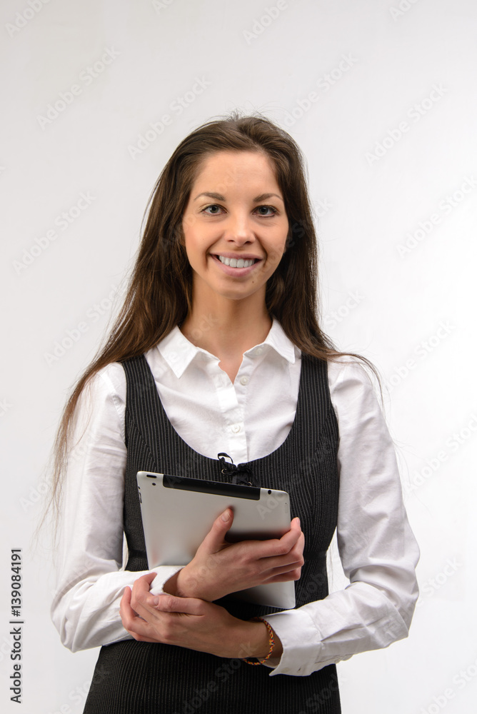 Attractive young business woman holding a digital tablet, on white Attractive young business woman holding a digital tablet, on white