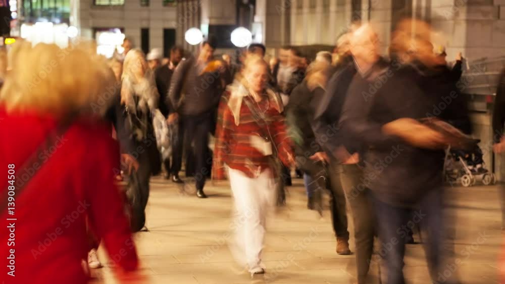 Time-lapse of commuters on London Bridge at night, London, England