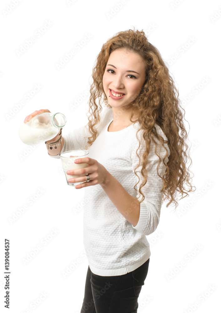 Young girl with bottle and glass of milk on white background