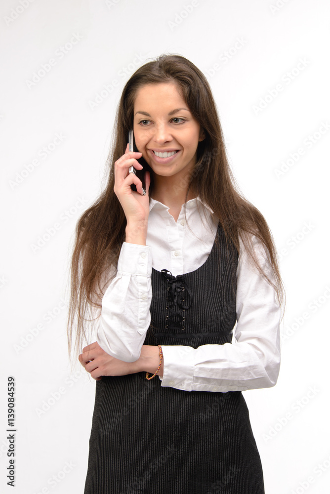 Attractive young business woman using her smartphone, on white Attractive young business woman using her smartphone, on white