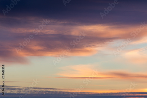 Fototapeta Naklejka Na Ścianę i Meble -  Beautiful cloudy sky background with sunset lights in violet tones