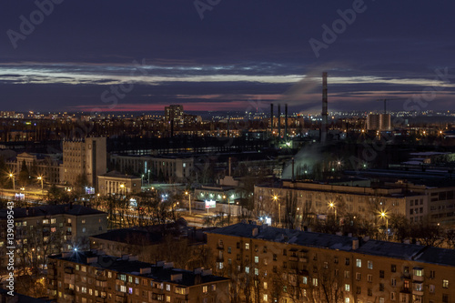 Night aerial winter cityscape view of industrial and living area in Voronezh