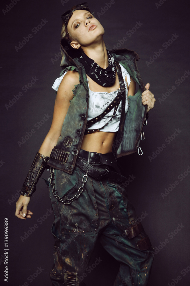 Young woman in brutal futuristic clothes