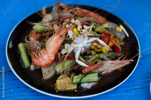 Mixed papaya salad put everything shrimp, crab, squid, Sausage.