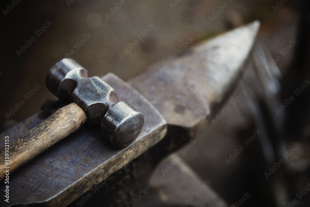 Hammer and small anvil, tools of farrier's trade Hammer and small anvil, tools of farrier's trade