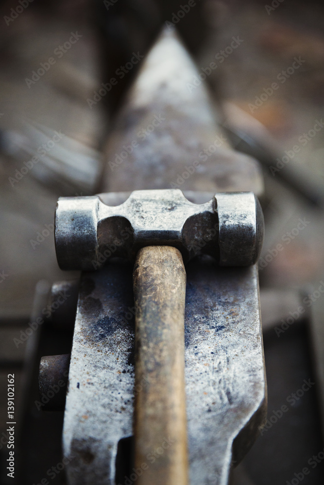 Hammer and small anvil, tools of farrier's trade Hammer and small anvil, tools of farrier's trade