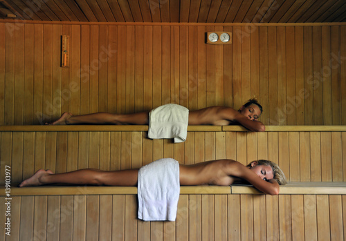 two beautiful women  relaxing in spa sauna