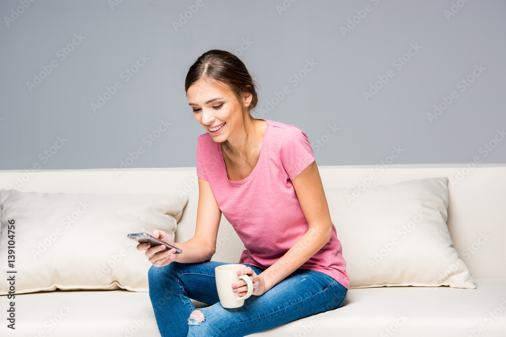 Smiling woman using smartphone Smiling woman using smartphone