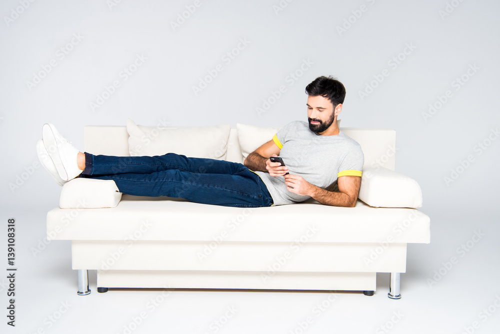 Fototapeta premium Bearded man using smartphone