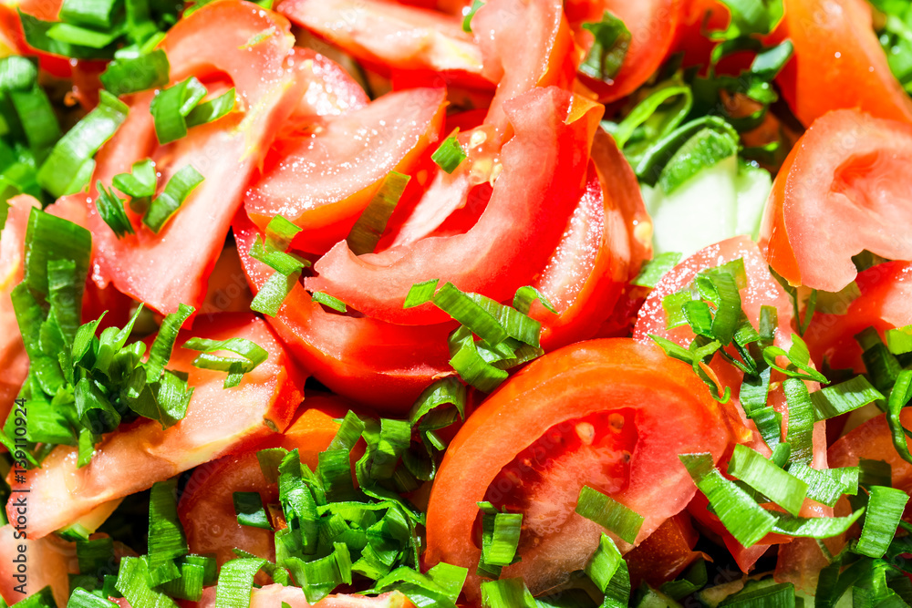 Background of tomato salad with green onions, black pepper and olive oil Background of tomato salad with green onions, black pepper and olive oil