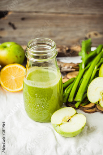 Detox fresh organic juice from green apple kale, lemon and celery