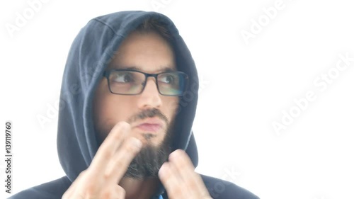 Closeup of self-confident bearded man in hoodie and eyeglasses dancing on contemporary electronic music, isolated on white background. photo