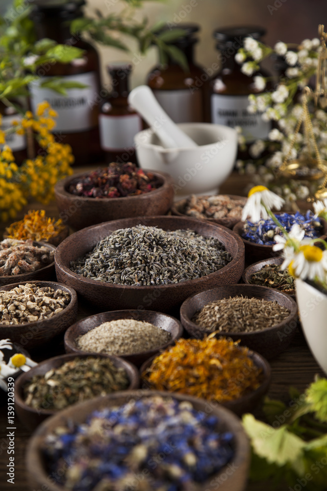 Natural medicine, herbs, mortar on wooden table background Natural medicine, herbs, mortar on wooden table background