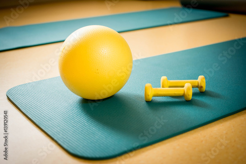 Therapeutic ball and weights for exercises photo