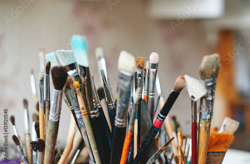 Painting brushes in artist workshop