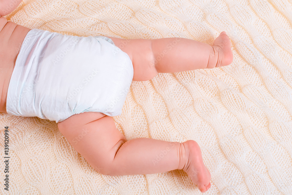 feet of a six months old baby wearing diapers feet of a six months old baby wearing diapers