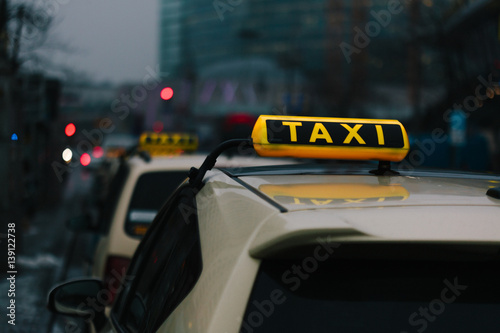 Generic yellow taxi sign on car roof in Germany