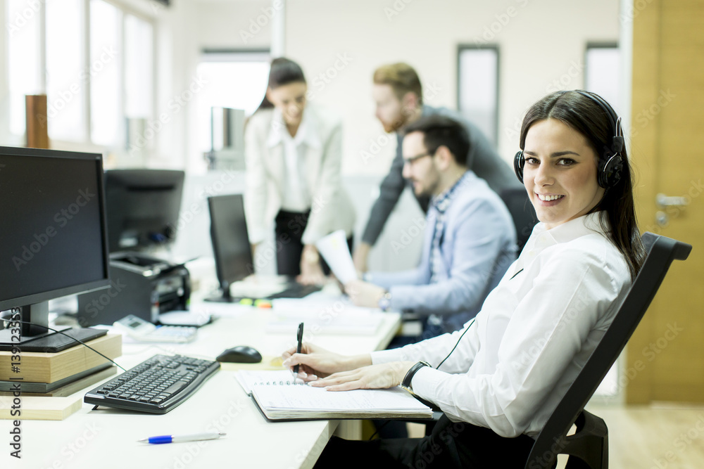 People working in a busy office People working in a busy office