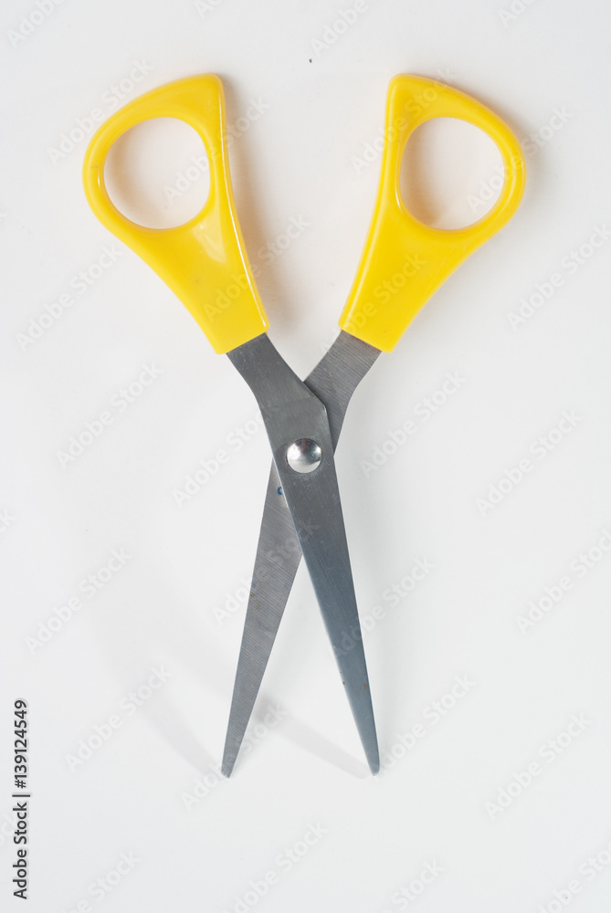 scissors with yellow handles on white background,