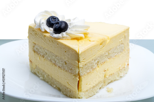 Cake with blueberries on white