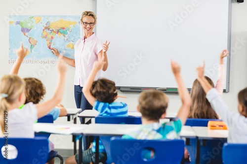 Teacher teaching kids in classroom