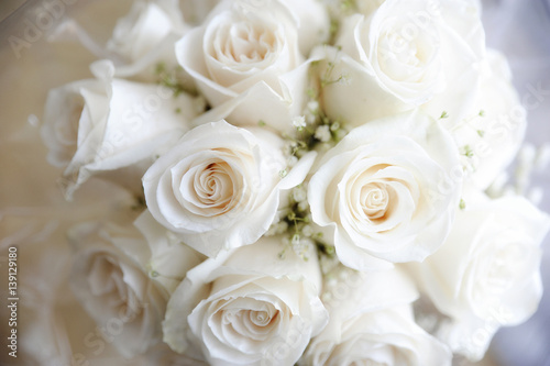 Romantic wedding bouquet closeup of white creamy roses