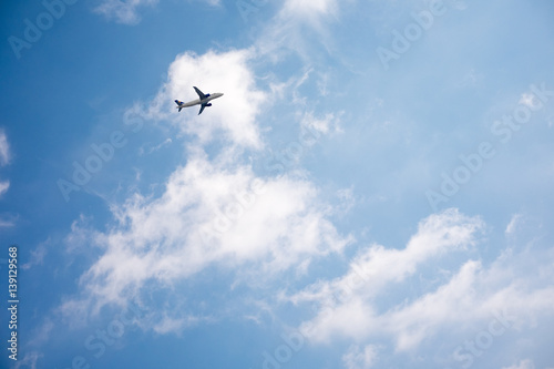 Fototapeta Naklejka Na Ścianę i Meble -  Airplane in the sky on kamari beach